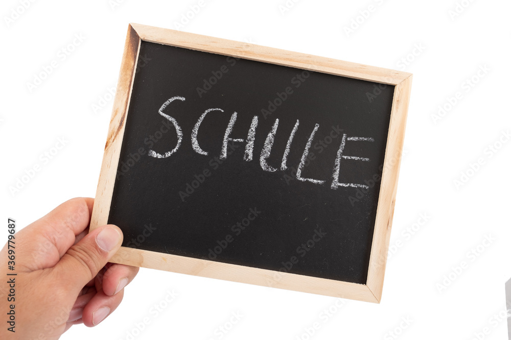 Eine männliche Hand mit einer kleinen Schreibtafel, auf der das Wort Eine männliche Hand mit einer kleinen Schreibtafel, auf der das Wort