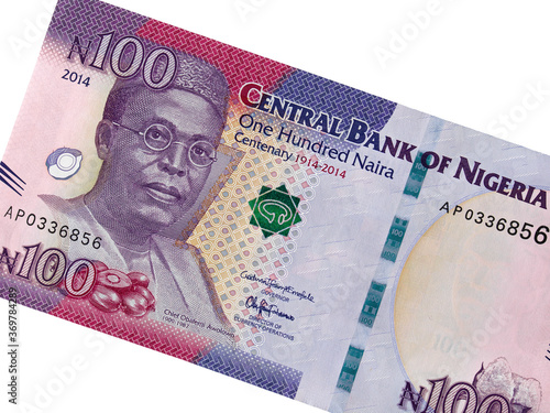 Nigeria 100 naira (2014) banknote isolated, Nigerian money closeup. Portrait of Obafemi Awolowo. photo