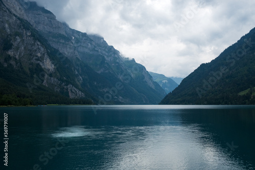 The lake Kloental in Switzerland  Glarus on a cloudy day day  copyspace between mountains  moody picture