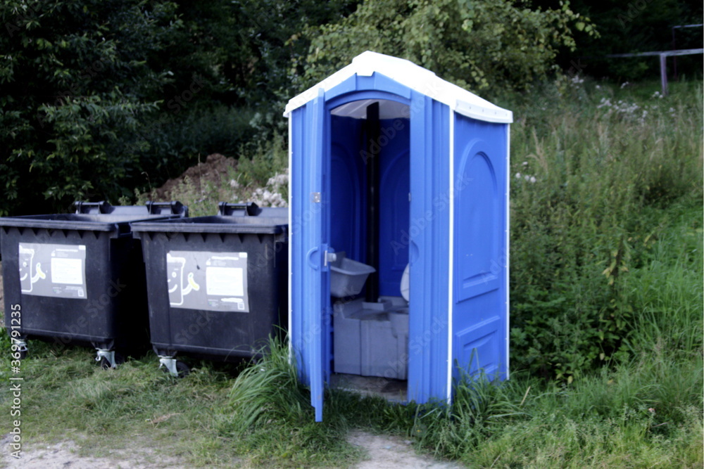 toilet and trash bins in the Park toilet and trash bins in the Park