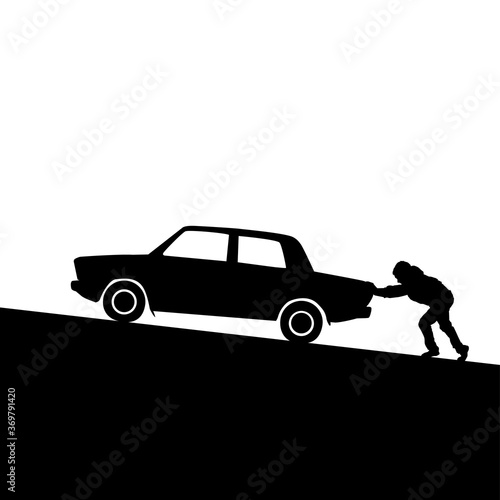 Silhouette of man pushing a car