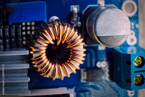 Obraz na plátně Ferrit inductance coil on electric board wrapped with copper wire