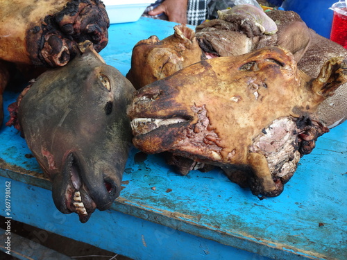 Burned heads of goats that are being sold at a market in the andes of South America