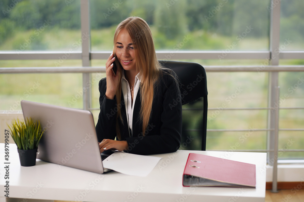 Portrait of young female designer in office Portrait of young female designer in office
