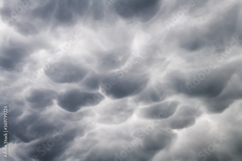 Stormy sky with menacing mammatus clouds before the storm. Climate change nature background