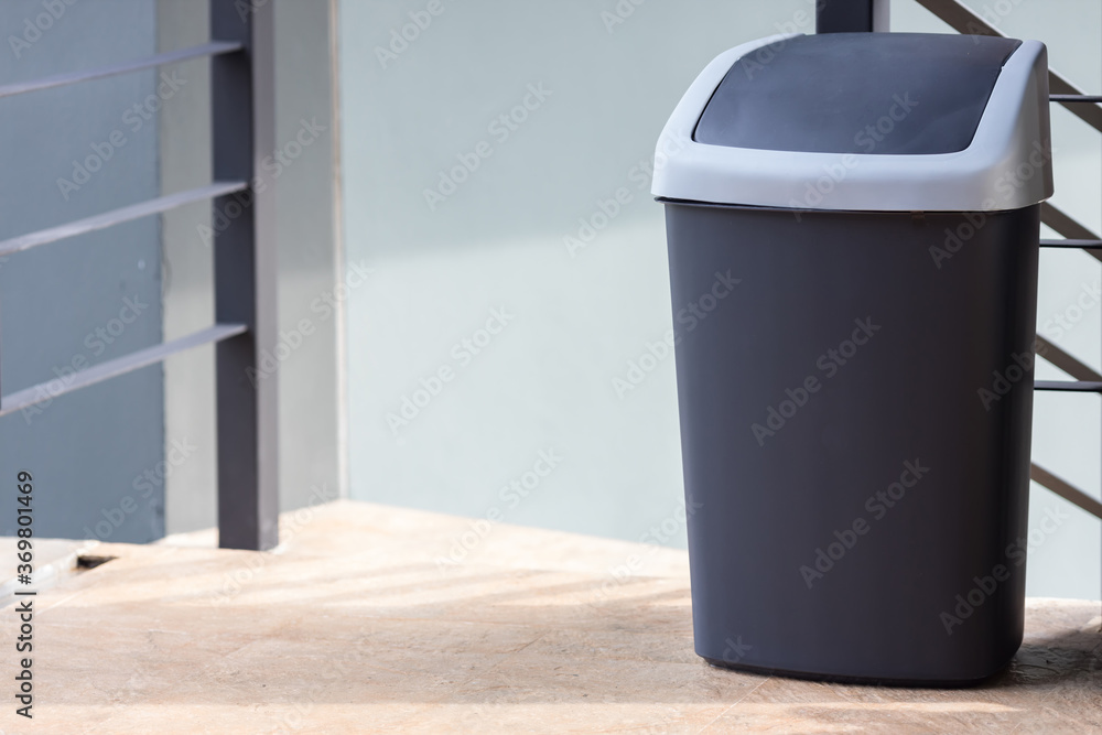 A black bin at home. black trash can. Garbage trash bin. A black bin at home. black trash can. Garbage trash bin.