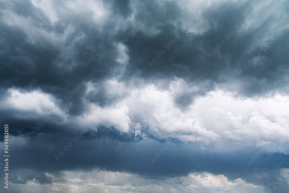 Dramatic storm clouds with rain closeup. Nature background