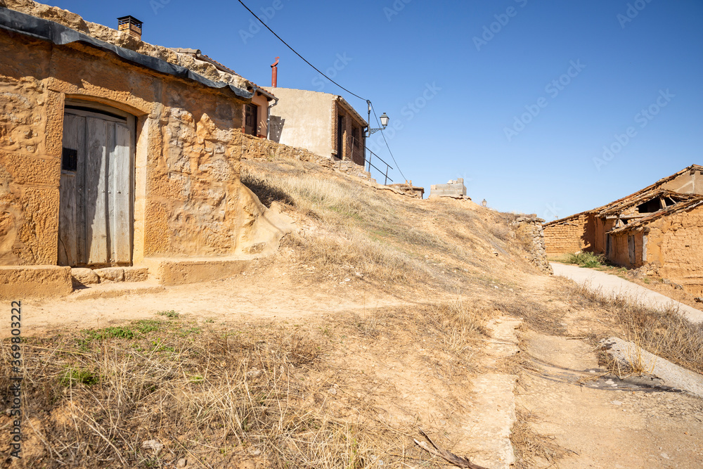 a street with old houses in Alcubilla del Marques village (Burgo de Osma), province of Soria, Castile and Leon, Spain