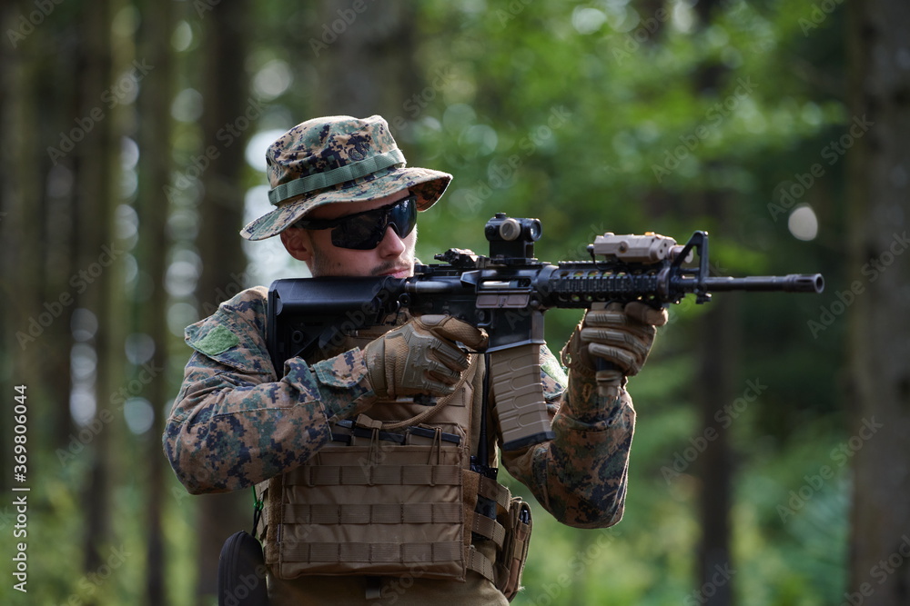 soldier in action aiming on weapon laser sight optics soldier in action aiming on weapon laser sight optics