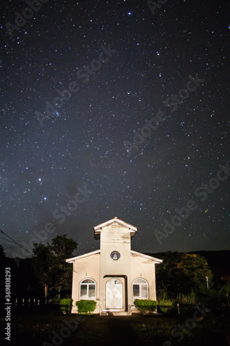 Stellar tracks on a moonlit night above church of Bom Jardim - Nobres - MT - Brazil
