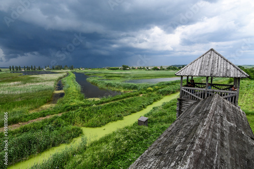 Close up of an old wooden fortress in Peresopnitsa  Ukraine  on the background of stormy sky. Wide angle view.