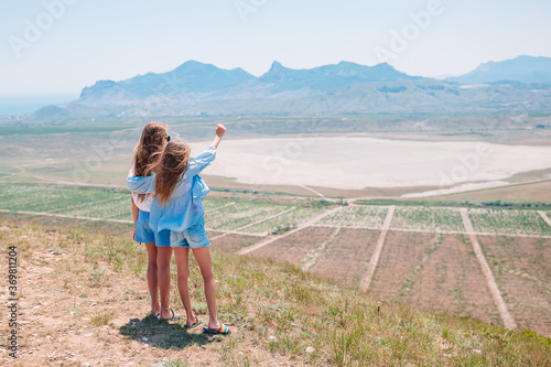 children on vacation on white rock background © travnikovstudio