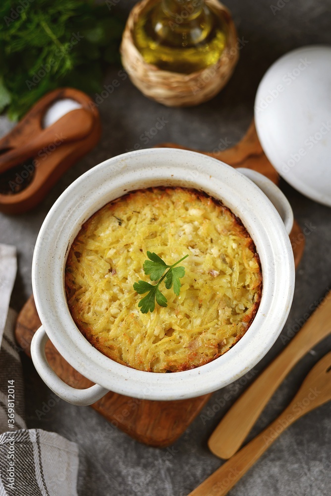 Potato casserole with feta cheese and onions.