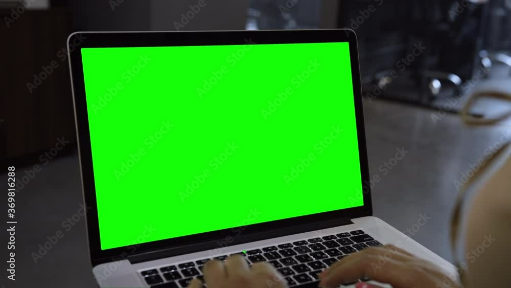 Laptop template with white transparent screen, computer blank display isolated. Metal device. Fingers press keys of the keyboard. Green Laptop template with white transparent screen, computer blank display isolated. Metal device. Fingers press keys of the keyboard. Green
