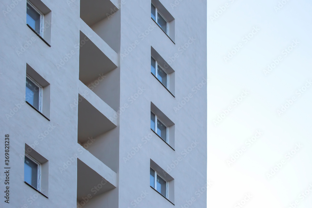 Facade of a new multi-story residential building. architecture and modern construction Facade of a new multi-story residential building. architecture and modern construction