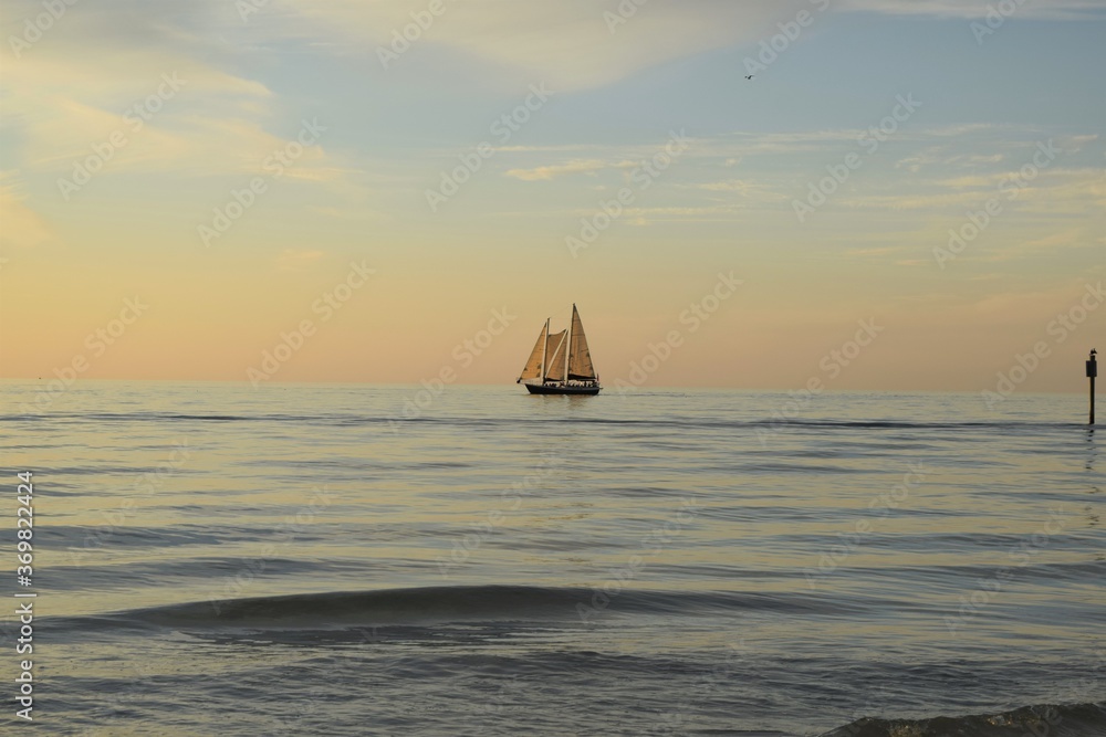 Clearwater Beach, Florida, Sailboat in the open sea at dusk