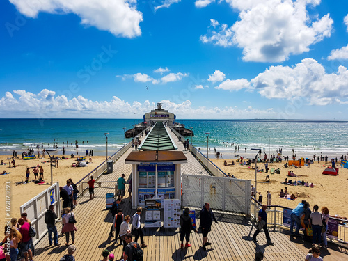 People on the pier at Bournemouth Beach in England photo