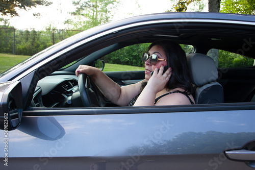 person having a heated phone call while driving