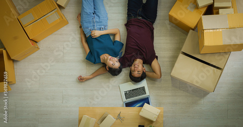 couple relax after unpacking boxes from house moving and relacation photo