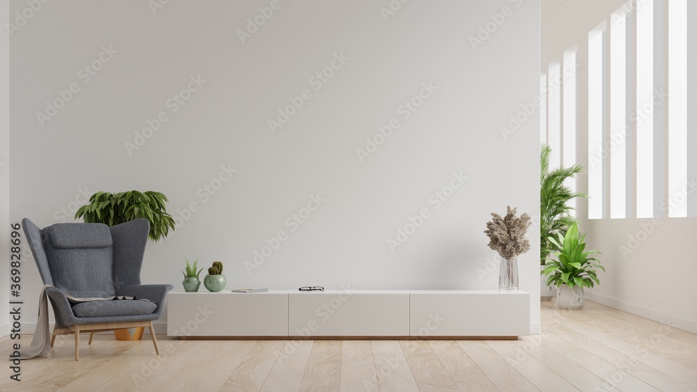 Interior of a bright living room with armchair on empty white wall background. - obrazy, fototapety, plakaty 