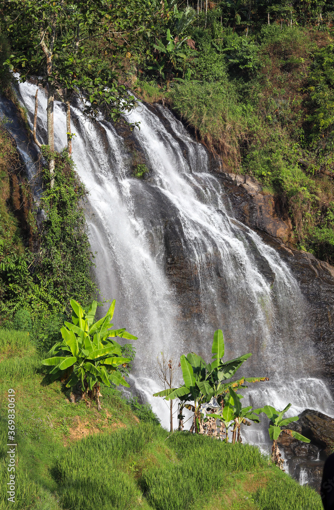 the swift water of the cikondang waterfall.