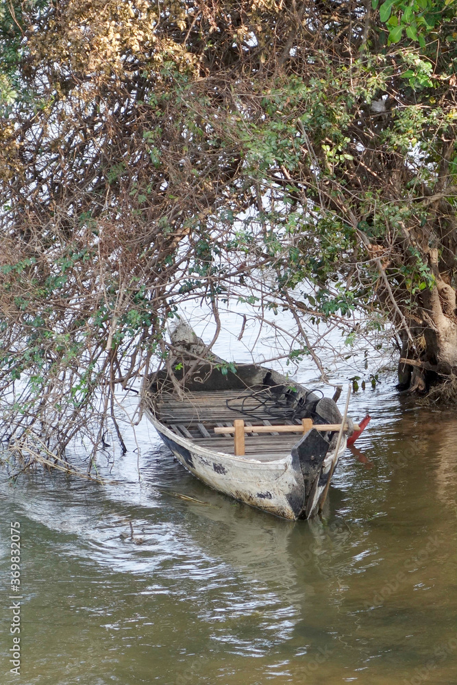 Rowing boat moored on the Mekong river near Luang Prabang, Laos.