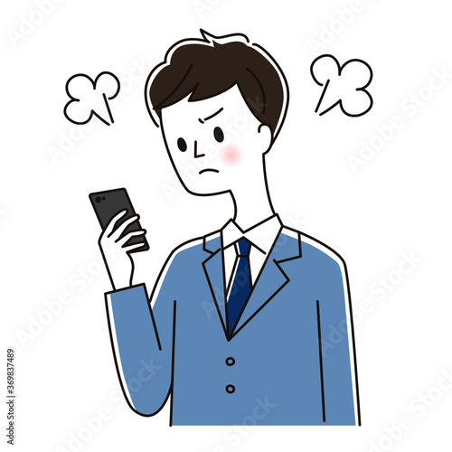 スマホを見て怒るスーツの男性