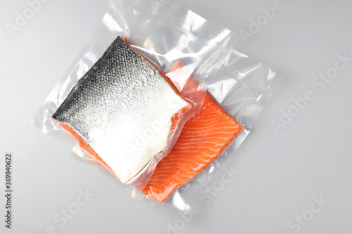 Salmon fillets in a vacuum package. Sous-vide, new technology cuisine. Selective focus, copy space