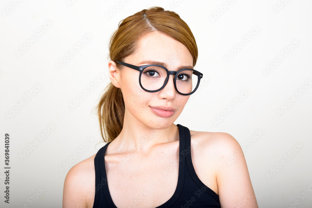 Portrait of young beautiful Asian woman with eyeglasses Portrait of young beautiful Asian woman with eyeglasses
