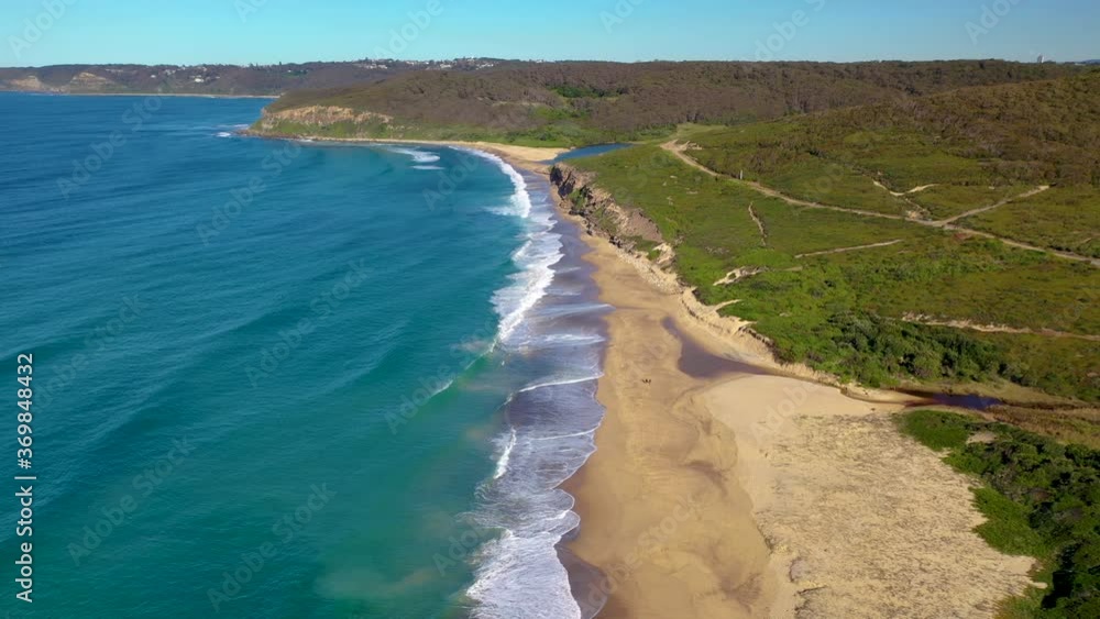 Tracking drone shot of cliffs and ocean at Merewether, New South Wales Tracking drone shot of cliffs and ocean at Merewether, New South Wales