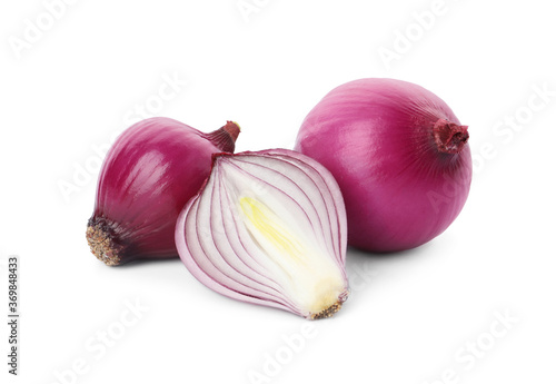 Fresh cut and whole red onion bulbs isolated on white