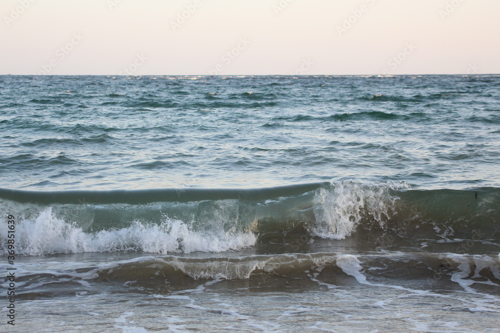 Water flowing on the beach