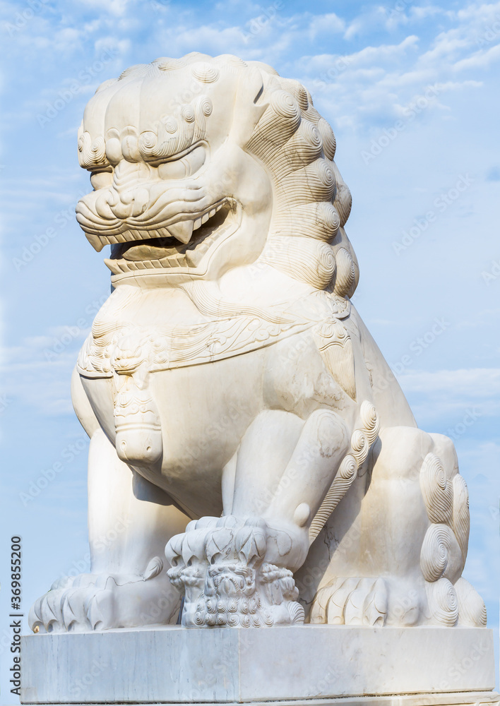 Lion statue on beautiful blue sky background
