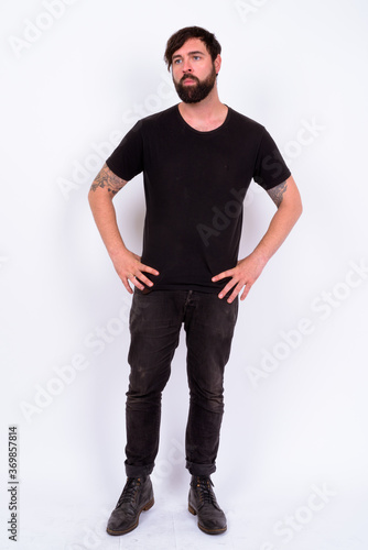 Portrait of handsome bearded man against white background