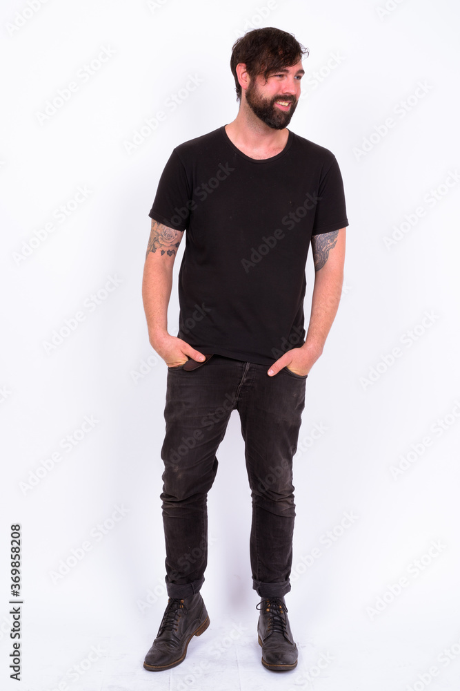 Fototapeta premium Portrait of happy handsome bearded man against white background