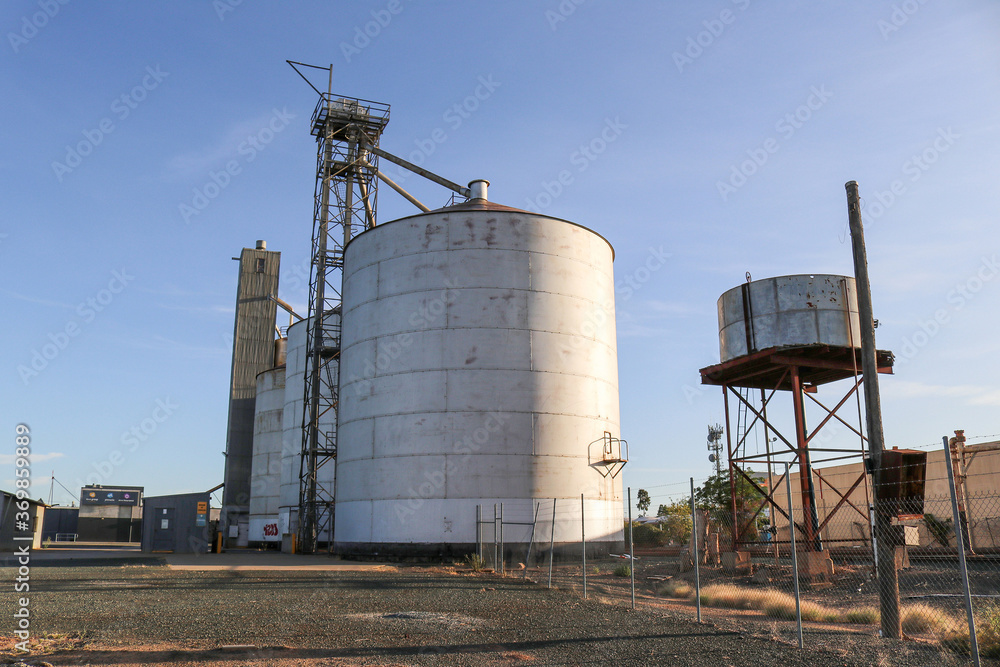 ECHUCA, AUSTRALIA - February 29, 2020: Steel silos and water tank at the Echuca railway station ECHUCA, AUSTRALIA - February 29, 2020: Steel silos and water tank at the Echuca railway station