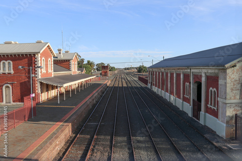 ECHUCA, AUSTRALIA - February 29, 2020: A view of the Echuca railway station platform, water tank and goods shed from the pedestrian footbridge overpass