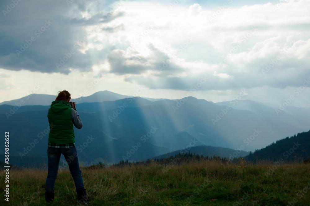 Fototapeta premium photographer in Ukraine Carpathians shoots a landscape