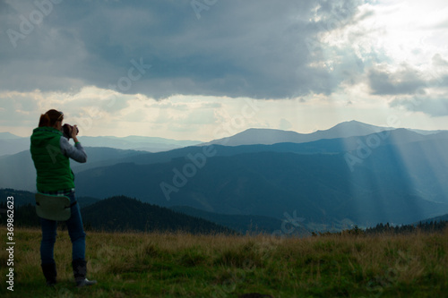 photographer in Ukraine Carpathians shoots a landscape