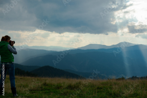 photographer in Ukraine Carpathians shoots a landscape