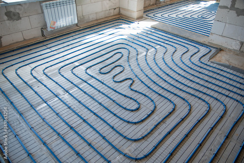 system for floor heating in the cold season. system of small tubes for hot water supply photo