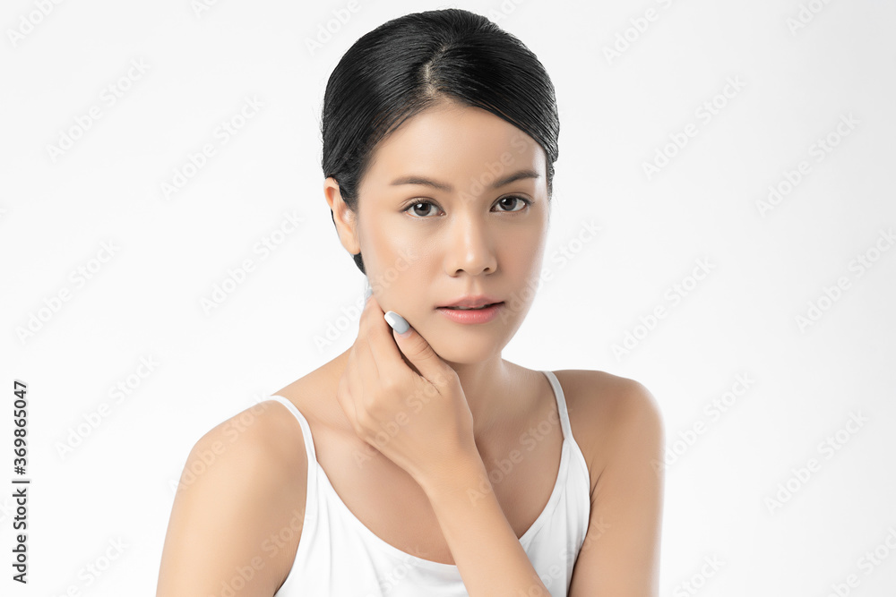Beautiful Young asian Woman with Clean Fresh Skin, on white background, Face care, Facial treatment, Cosmetology, beauty and spa, Asian women portrait Beautiful Young asian Woman with Clean Fresh Skin, on white background, Face care, Facial treatment, Cosmetology, beauty and spa, Asian women portrait