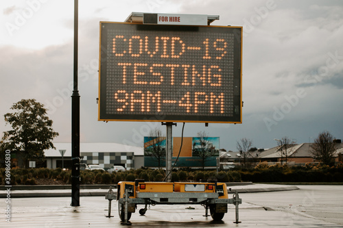Covid-19 pandemic testing sign, with focus on the trailer