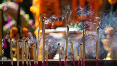 Fototapeta Naklejka Na Ścianę i Meble -  Incense chanting at Wat Bang Phra in Thailand,Great Church
