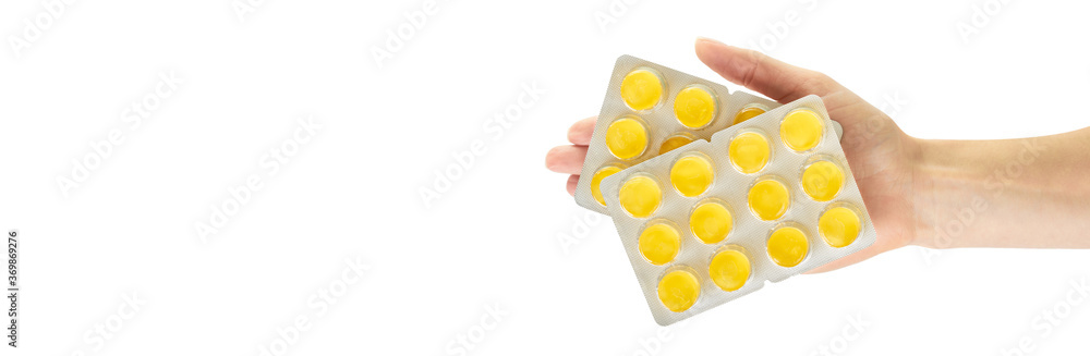 Throat ache pills in bister, isolated on white background. Copy space template, banner. Throat ache pills in bister, isolated on white background. Copy space template, banner.