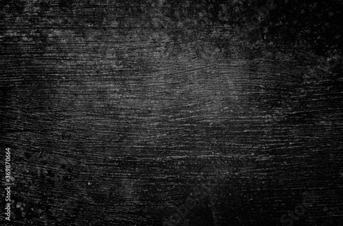 Blurred black wall concrete texture. Dark tone scrached cement background