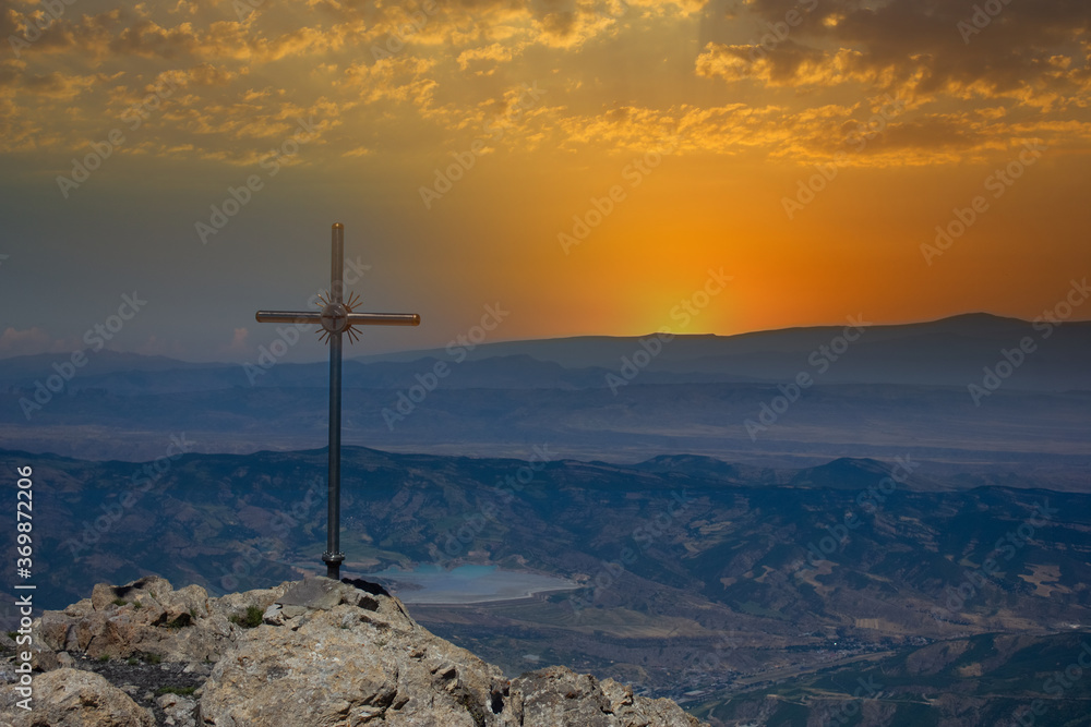 cross on top of a mountain