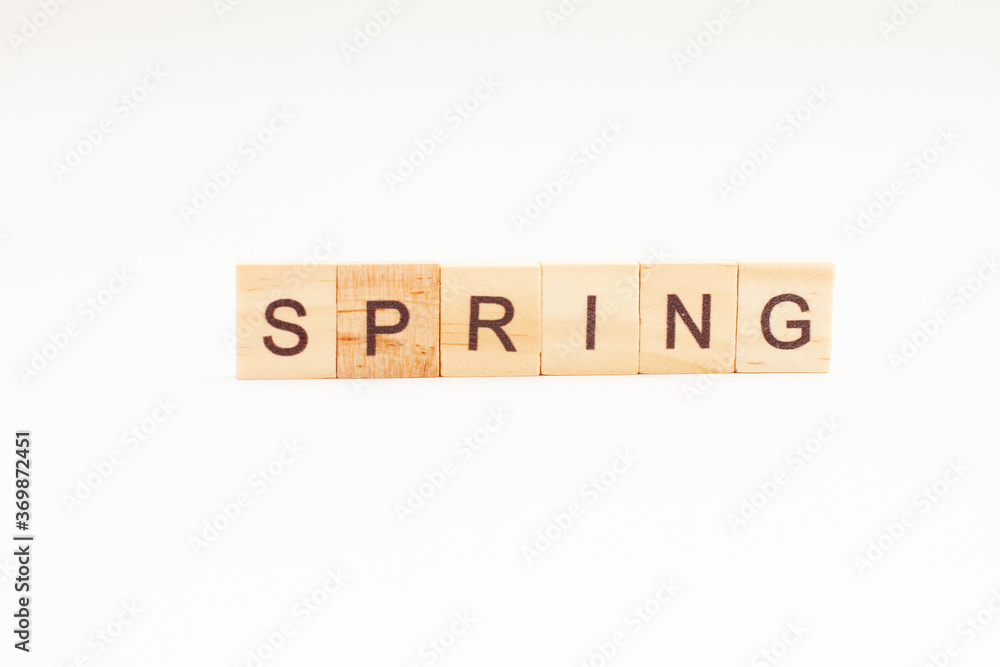 SPRING words on wooden blocks. Concept Seasons of year SPRING words on wooden blocks. Concept Seasons of year