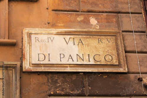 old street name sign on the wall