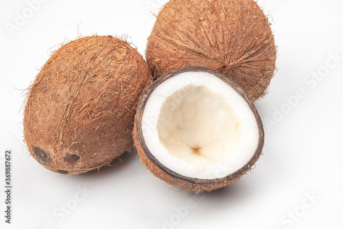 cut fresh coconut on a white background. vitamin fruits. healthy food
